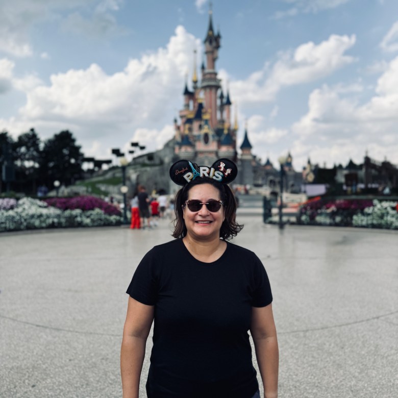 Marisa at Disneyland Paris in front of Bell's castle